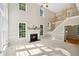 Spacious living room with fireplace, cathedral ceilings, and an abundance of natural light at 5940 Dahlberg Dr, Raleigh, NC 27603
