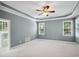 Spacious main bedroom with ceiling fan and natural light at 5940 Dahlberg Dr, Raleigh, NC 27603