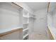 Organized walk-in closet with shelving and hanging space at 5940 Dahlberg Dr, Raleigh, NC 27603