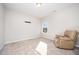 Bedroom featuring plush carpet and beige recliner near window to maximize sunlight at 614 Marian Way, Sanford, NC 27330