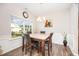 Bright dining room with hardwood floors, a chandelier, and a large window at 614 Marian Way, Sanford, NC 27330