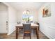 Bright dining room with hardwood floors, a chandelier, and a large window at 614 Marian Way, Sanford, NC 27330