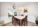 Bright dining room with hardwood floors, a chandelier, and a large window at 614 Marian Way, Sanford, NC 27330