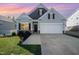 Charming single-Gathering home with a well-manicured lawn and attached two-car garage at 614 Marian Way, Sanford, NC 27330