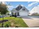 Charming single-Gathering home with a well-manicured lawn and attached two-car garage at 614 Marian Way, Sanford, NC 27330
