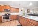 Bright kitchen featuring stainless steel appliances, granite countertops, and open concept living at 614 Marian Way, Sanford, NC 27330