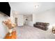 Large open living room with plush carpet, a leather sofa and a mounted TV at 614 Marian Way, Sanford, NC 27330