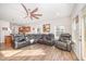 Spacious living room featuring hardwood floors, ceiling fan, and plenty of natural light at 614 Marian Way, Sanford, NC 27330