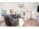Bright living room with hardwood floors and a comfortable seating area under a ceiling fan at 614 Marian Way, Sanford, NC 27330