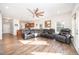Open-concept living room featuring hardwood floors, recessed lighting, and comfortable seating at 614 Marian Way, Sanford, NC 27330