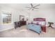 Cozy main bedroom with carpet flooring, ceiling fan, and lots of natural light at 614 Marian Way, Sanford, NC 27330