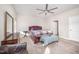Comfortable main bedroom with ceiling fan, carpet, and ample space for furniture at 614 Marian Way, Sanford, NC 27330