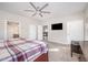 Spacious main bedroom with carpet flooring, ceiling fan, and access to the ensuite bathroom at 614 Marian Way, Sanford, NC 27330