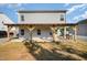 Back patio features a partially covered pergola, perfect for entertaining guests or relaxing outdoors at 614 Marian Way, Sanford, NC 27330