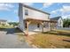 Back patio features a partially covered pergola, and provides the perfect space to relax or grill out back at 614 Marian Way, Sanford, NC 27330