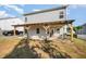 Back patio features a partially covered pergola, and is perfect for entertaining guests or relaxing outdoors at 614 Marian Way, Sanford, NC 27330
