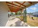 Covered back patio that is partially covered, perfect for entertaining guests or relaxing outdoors at 614 Marian Way, Sanford, NC 27330