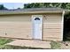 Exterior shot of a side entrance with a white door and concrete pad at 621 Reservoir St, Durham, NC 27703