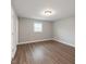 Bedroom with wood-look flooring and neutral paint at 621 Reservoir St, Durham, NC 27703