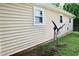 Exterior of the home featuring durable vinyl siding and framed windows at 621 Reservoir St, Durham, NC 27703