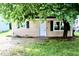 Cozy home exterior with a lush tree providing shade and curb appeal at 621 Reservoir St, Durham, NC 27703