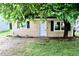 A cozy home with well-placed windows and tree providing shade and curb appeal at 621 Reservoir St, Durham, NC 27703