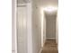 Hallway with wood-look flooring with white doors at 621 Reservoir St, Durham, NC 27703