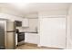 Modern kitchen featuring stainless steel appliances, granite countertops, and white subway tile backsplash at 621 Reservoir St, Durham, NC 27703