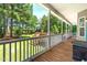 Large backyard deck with views of a grassy yard, mature trees, and a fence at 63 Majestic Oak Dr, Garner, NC 27529