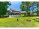 A well-maintained backyard featuring a pool, fire pit, and fenced perimeter at 63 Majestic Oak Dr, Garner, NC 27529