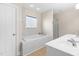 Elegant bathroom featuring a soaking tub, and a glass-enclosed shower at 63 Majestic Oak Dr, Garner, NC 27529