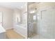 Bathroom featuring a soaking tub, walk-in shower, and neutral tile at 63 Majestic Oak Dr, Garner, NC 27529