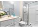 Bathroom showcasing a glass-enclosed shower, white vanity, framed mirror, and modern fixtures at 63 Majestic Oak Dr, Garner, NC 27529