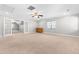Expansive bonus room with a ceiling fan, neutral carpet, and an adjacent room at 63 Majestic Oak Dr, Garner, NC 27529