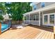 A spacious wooden deck with outdoor seating and a partial view of a swimming pool at 63 Majestic Oak Dr, Garner, NC 27529