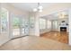 Inviting dining area with access to the deck and view of the living room at 63 Majestic Oak Dr, Garner, NC 27529