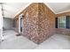 Close-up of a covered brick porch with a welcoming entrance, adding charm and character to the home's exterior at 63 Majestic Oak Dr, Garner, NC 27529