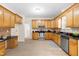 Kitchen features wood cabinets, stainless appliances and is spacious with room to gather at 63 Majestic Oak Dr, Garner, NC 27529