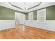 Bright living room featuring hardwood floors, tray ceiling, and decorative molding at 63 Majestic Oak Dr, Garner, NC 27529