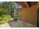 Back patio with flagstone paving and small table and chairs, great for entertaining outdoors at 6700 Falconbridge Rd, Chapel Hill, NC 27517