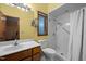 Bathroom features a white walk-in shower with new fixtures and yellow walls at 6700 Falconbridge Rd, Chapel Hill, NC 27517