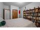 Bedroom featuring built-in bookshelves, closet and light walls, providing a cozy, inviting atmosphere at 6700 Falconbridge Rd, Chapel Hill, NC 27517