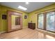 Bright bedroom featuring a large built-in mirror, a skylight, and a window providing natural light at 6700 Falconbridge Rd, Chapel Hill, NC 27517