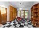 Dining room offers black and white flooring and a wooden built-in at 6700 Falconbridge Rd, Chapel Hill, NC 27517