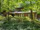Secluded two-story home surrounded by a lush landscape at 6700 Falconbridge Rd, Chapel Hill, NC 27517
