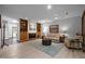 Living room with built-in shelving, fireplace, sofa, and a light blue area rug at 6700 Falconbridge Rd, Chapel Hill, NC 27517