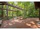 Inviting brick patio with a pergola, perfect for outdoor dining and relaxation at 6700 Falconbridge Rd, Chapel Hill, NC 27517