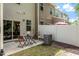 Backyard space with patio, partial fencing, and greenery at 7879 Allscott Way, Raleigh, NC 27612