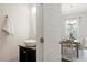 Bathroom featuring modern fixtures, a stylish sink, and convenient access to the dining area at 7879 Allscott Way, Raleigh, NC 27612