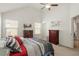 Bedroom with neutral paint, ceiling fan and a view of the outside at 7879 Allscott Way, Raleigh, NC 27612